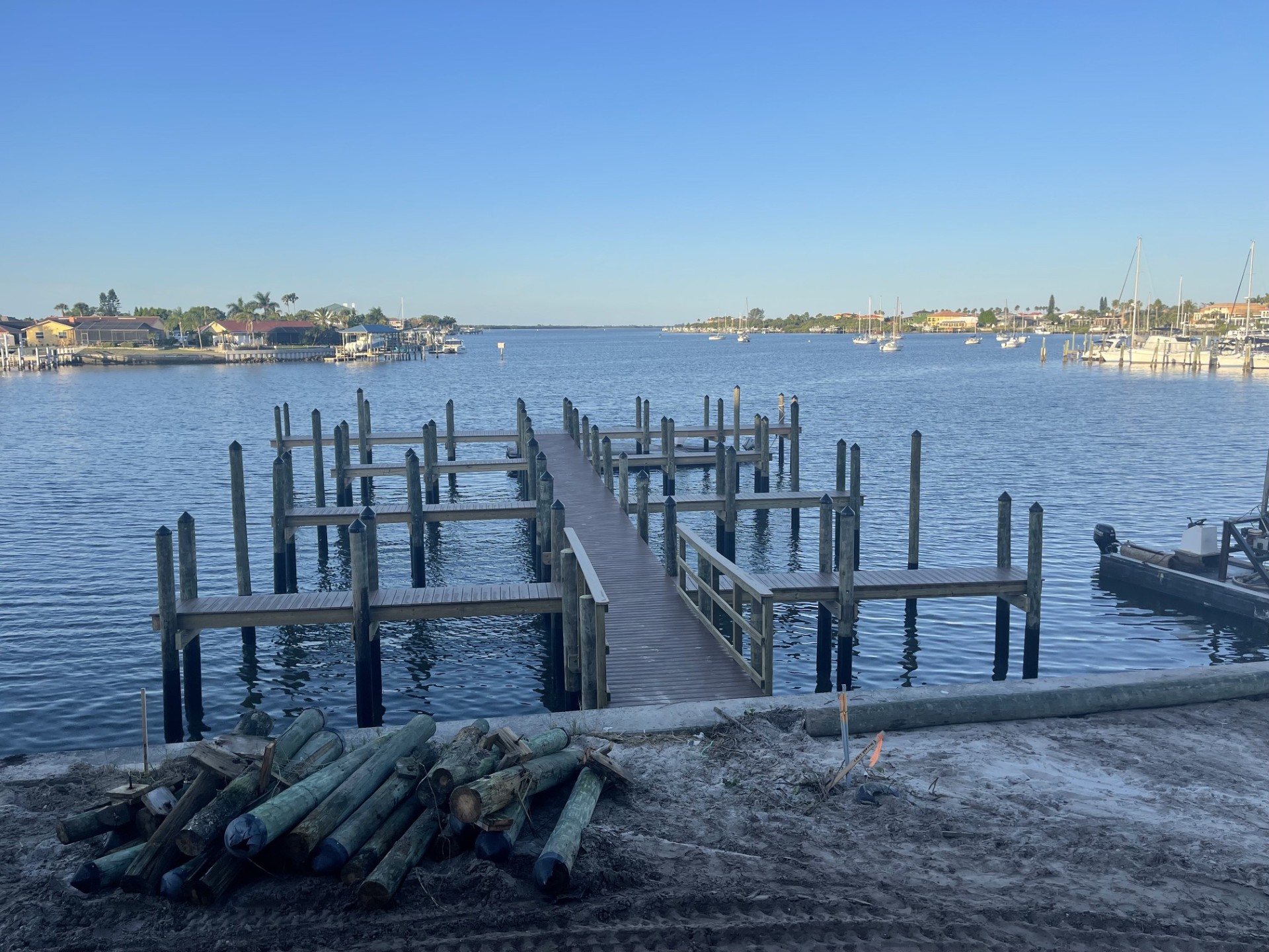 White dock and ramp on a Tampa Bay shoreline