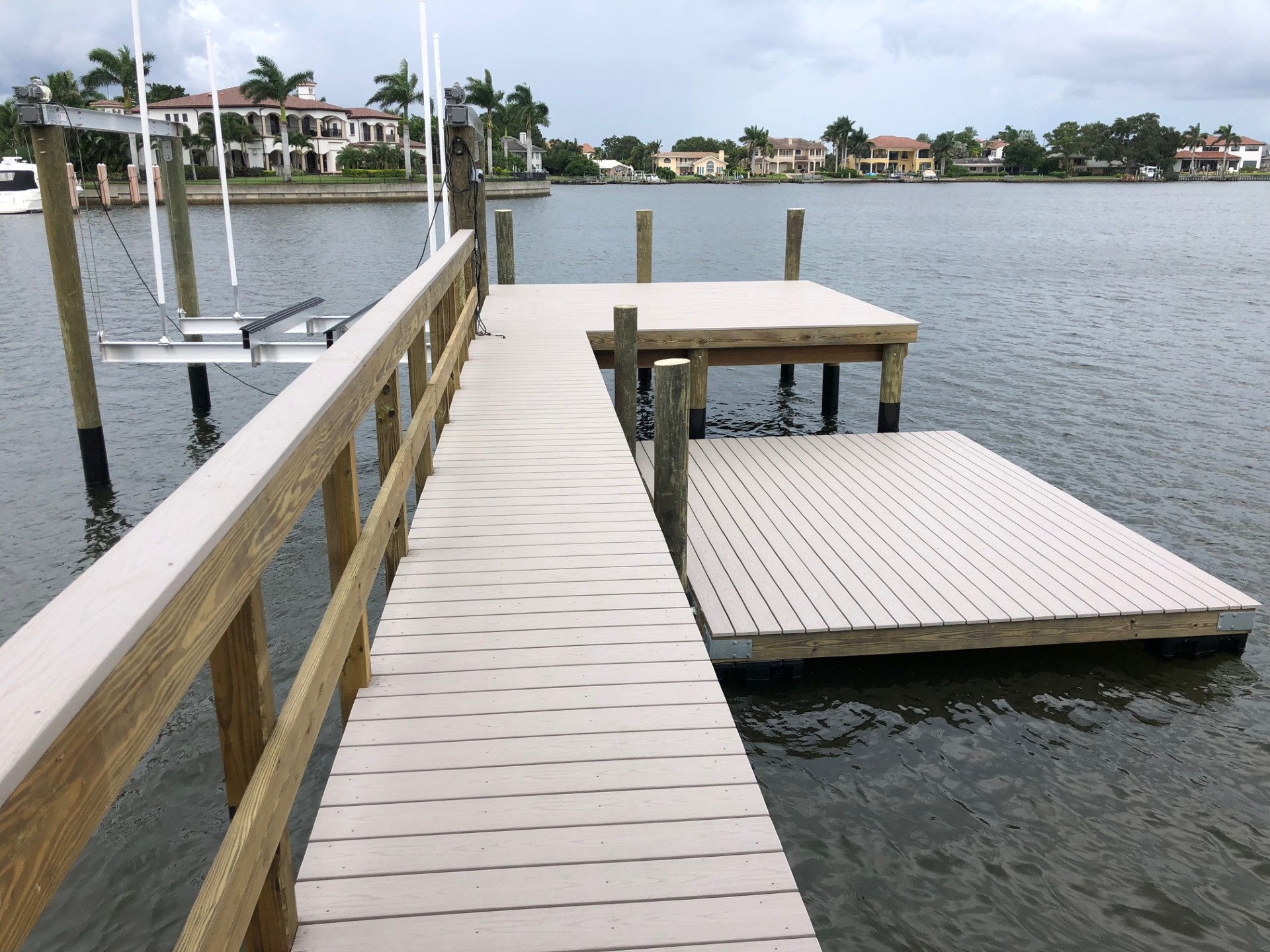 Waterfront dock with railings at sunrise