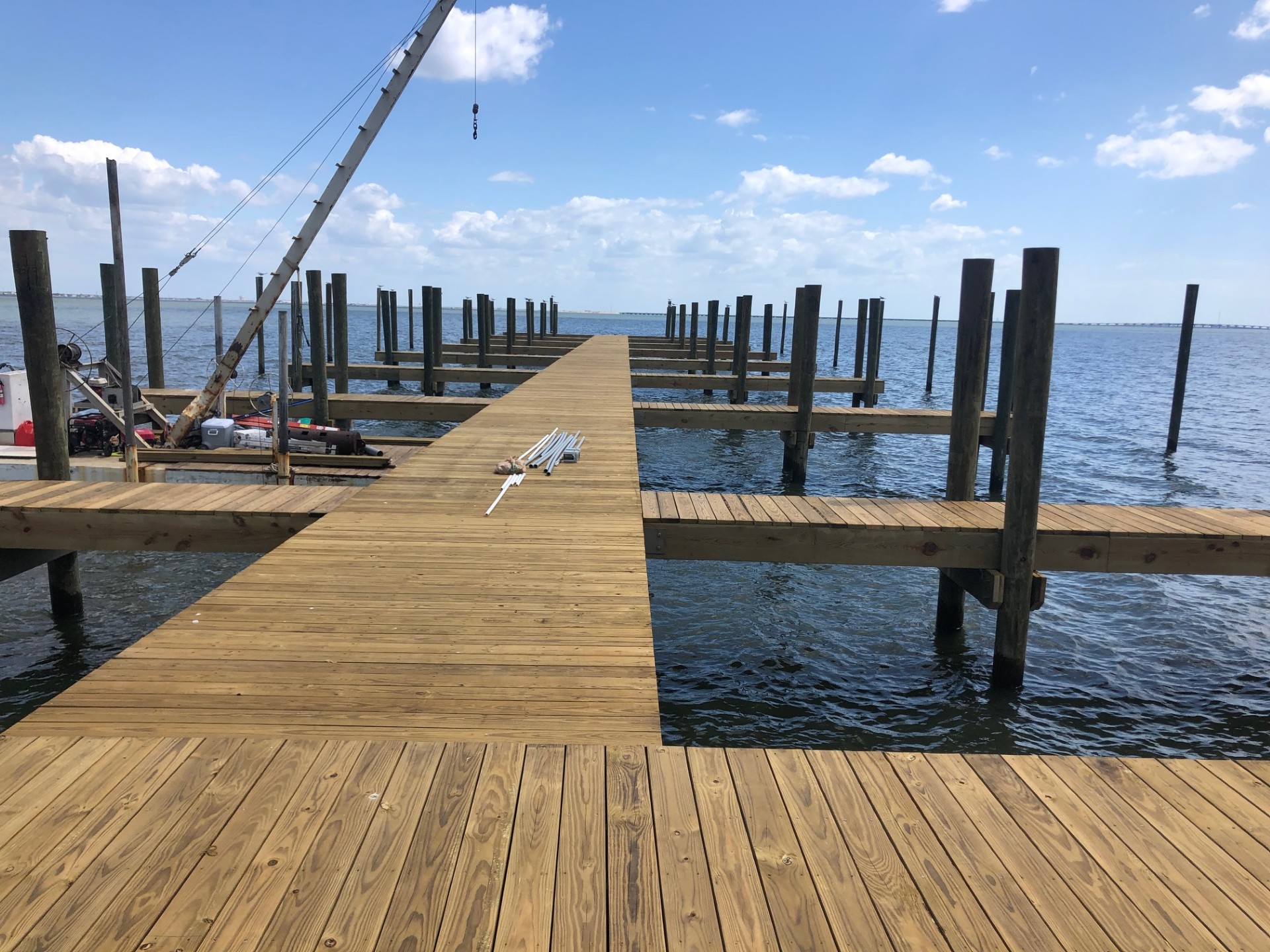 Dock framing supported on newly set pilings