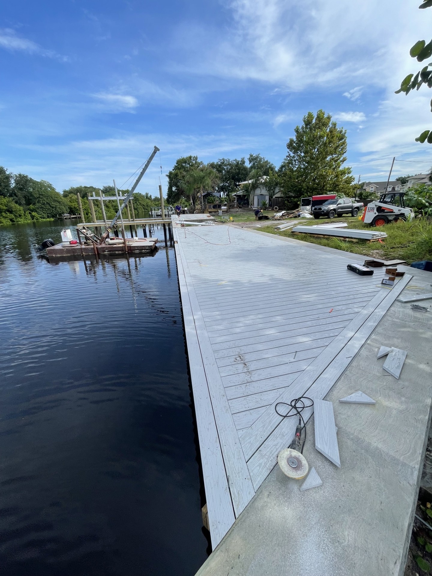 Work barge supporting a marine construction project