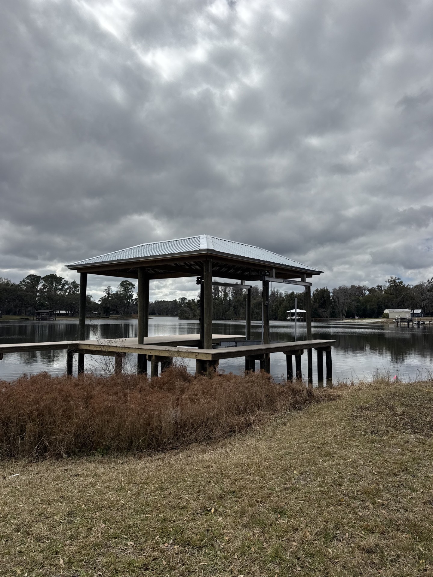 Twin boat lifts on a residential canal