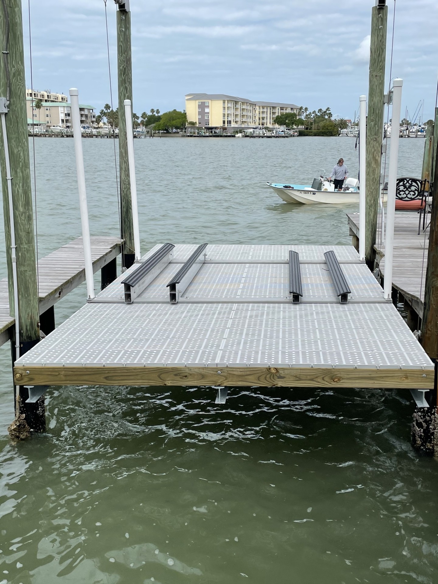 Boat lift platform and drive motors above the water
